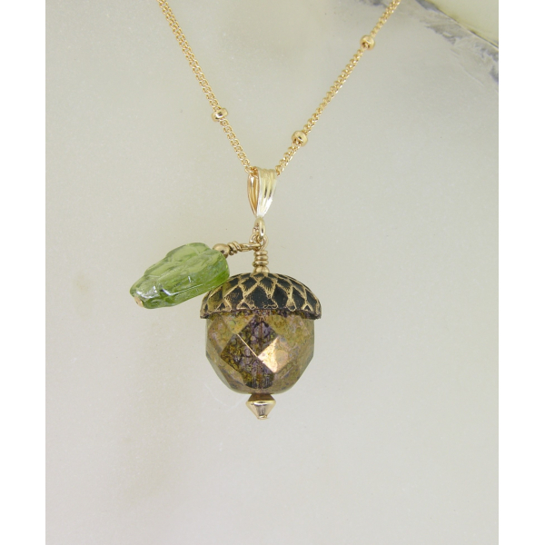 Handmade necklace with faceted golden glass acorn green glass leaf gold fill