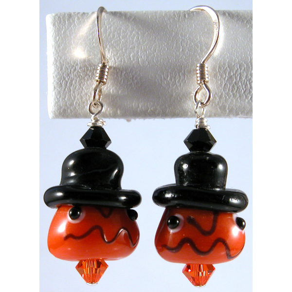 Handmade artisan halloween earrings with orange pumpkin face and sterling silver