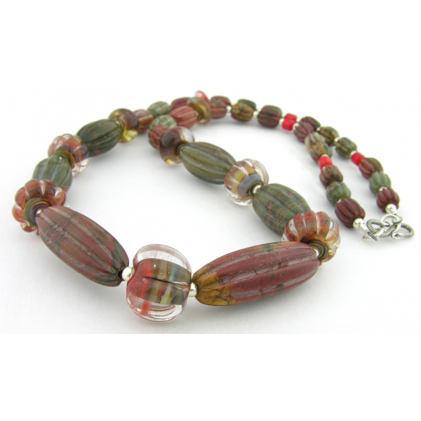 Handmade necklace with carved red creek jasper lampwork coral sterling