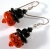 Handmade artisan halloween earrings with orange pumpkin face and sterling silver