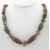 Handmade necklace with carved red creek jasper lampwork coral sterling