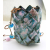 Pink and Blue with a little Raku Air Plant Hangar and Copper Chain Woven and enameled copper planter, showing a closeup of the planter