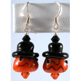 Handmade artisan halloween earrings with orange pumpkin face and sterling silver
